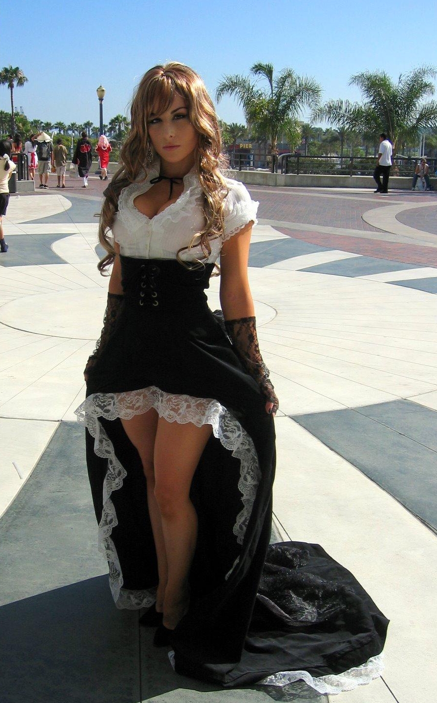 Blonde Lolita with Bare Legs wearing Black and White Long Dress and Black Stilettos